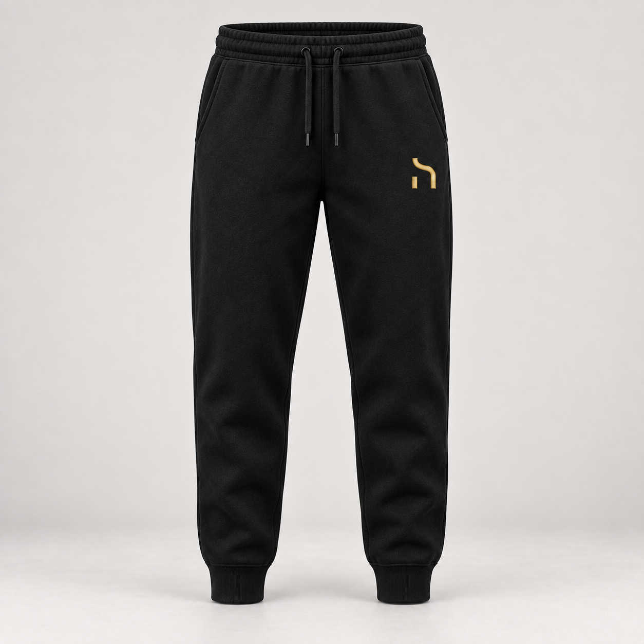 Haensch Utility Premium Jogger in Schwarz mit goldenem Haensch-Zeichen auf dem linken Oberschenkel.