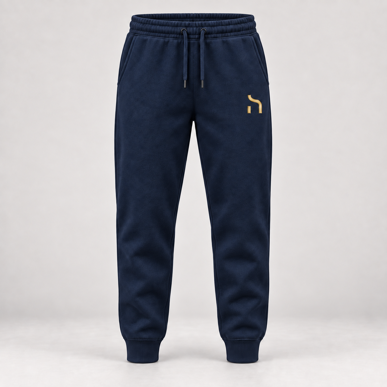 Haensch Utility Premium Jogger in Marineblau mit goldenem Haensch-Zeichen auf dem linken Oberschenkel.