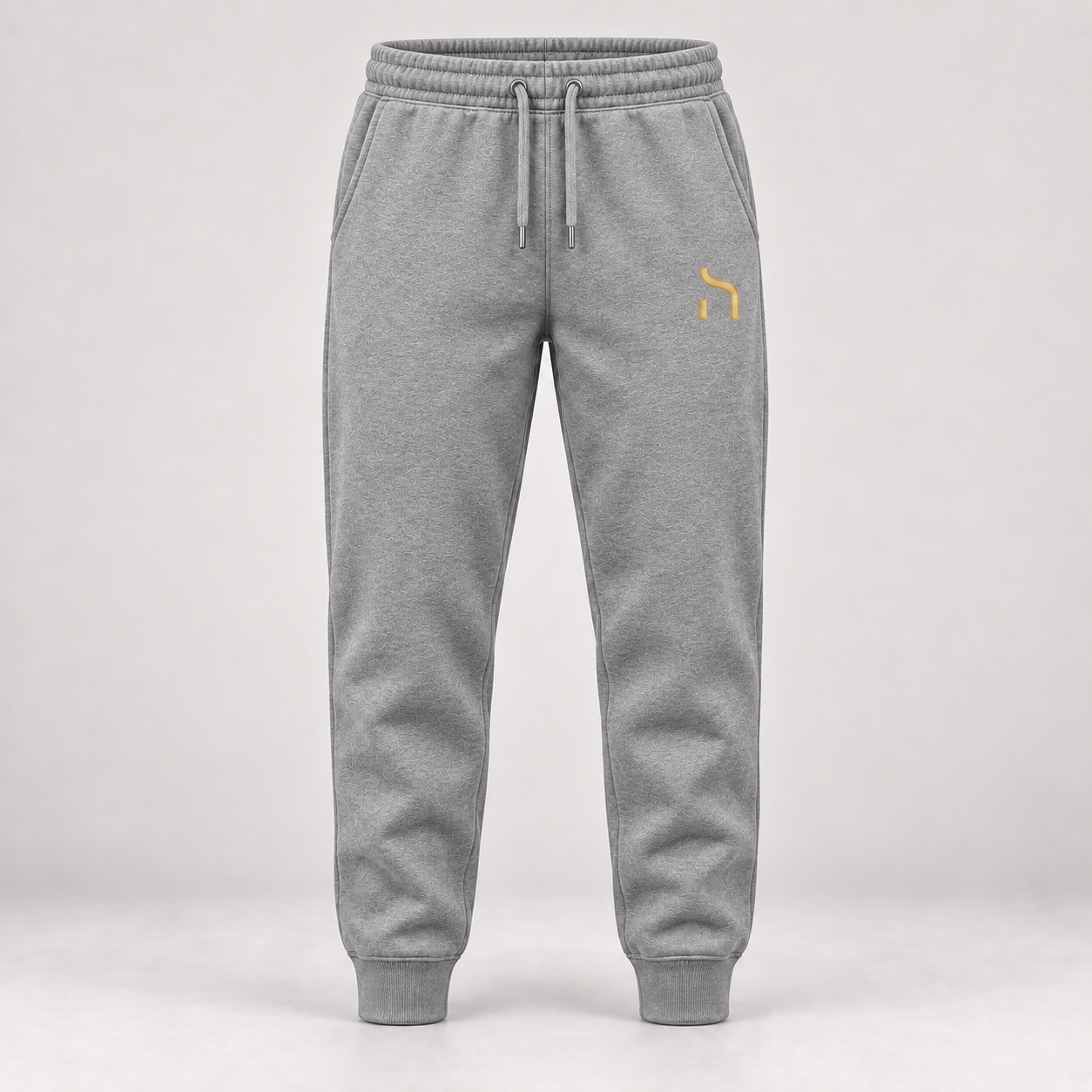 Haensch Utility Premium Jogger in Graumeliert mit goldenem Haensch-Zeichen auf dem linken Oberschenkel.
