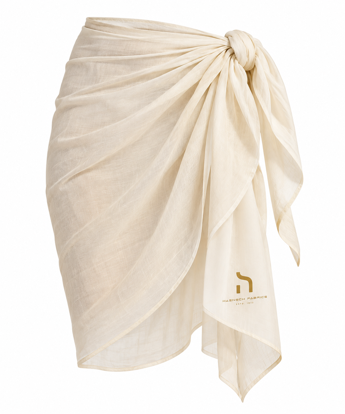 Ivory Haensch Coast sarong with gold Haensch branding, draped and tied at the hip in a clean product view on a white background.