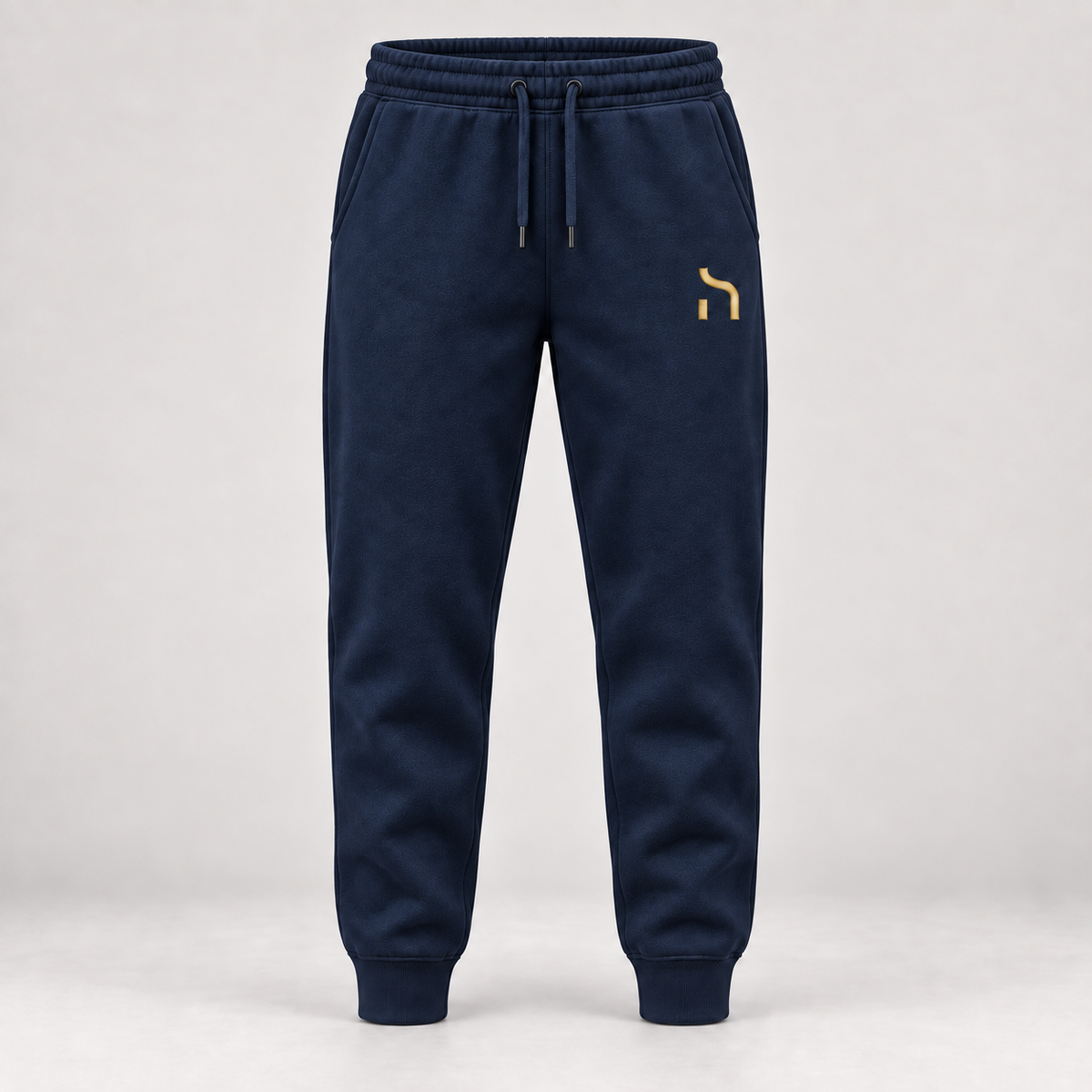 Haensch Utility Premium Jogger in Marineblau mit goldenem Haensch-Zeichen auf dem linken Oberschenkel.